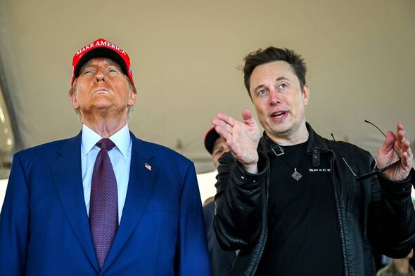 Donald Trump listens to Elon Musk as he arrives to watch SpaceX's mega-rocket Starship lift off