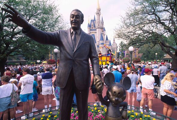 A statue of Walt Disney and Mickey Mouse at Disney World