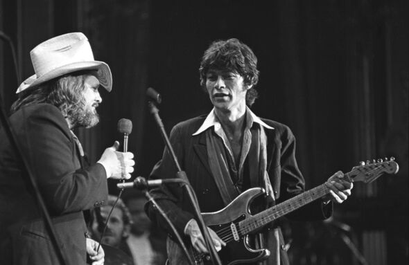 Robbie Robertson performing.