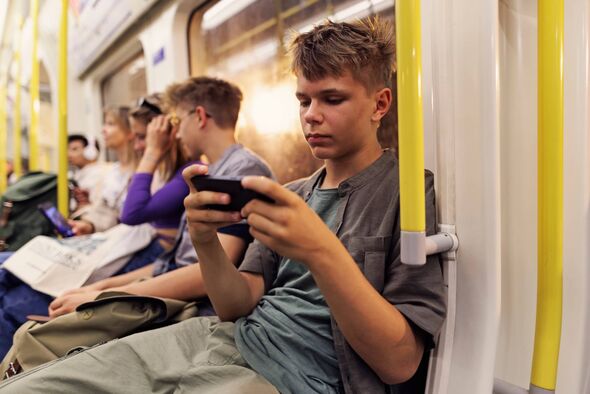 Teenagers travelling in London  train