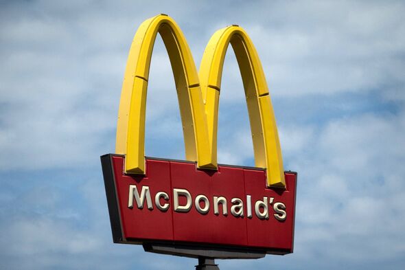 A sign towers over a McDonald's restaurant