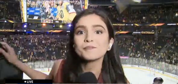 Samantha Rivera of CBS News Miami had to prevent a fan from jumping into view